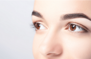 Woman with beautiful eyebrows close-up