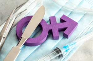 Transgender symbol and scalpel with a syringe